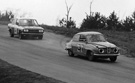 Billy Couch drives the IMSA Baby Grand SAAB 96 V4 through the top of the Roller Coaster at Virginia International Raceway.